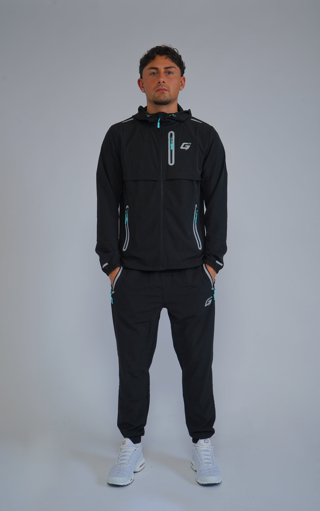 REFLECT 1.0 TRACKSUIT - BLACK/AQUA